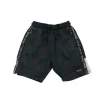 Nutmeg 8-9 years black jersey digital camouflague shorts